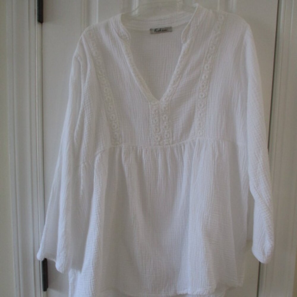 White gauze embroidered long sleeve top.